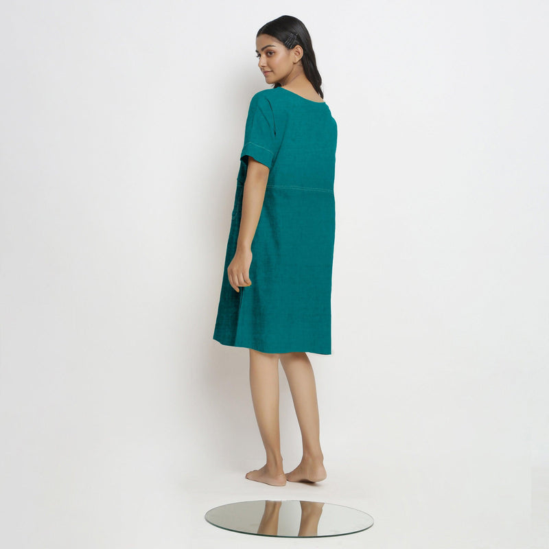 Back View of a Model wearing Pine Green 100% Linen Knee Length Yoked Dress