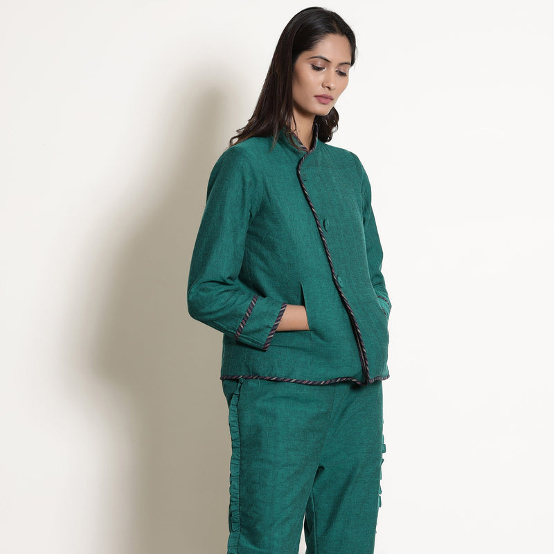 Right View of a Model wearing Pine Green Reversible Asymmetric Jacket