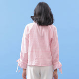 Back View of a Model wearing Pink Hand Block Printed Button-Down Blouse