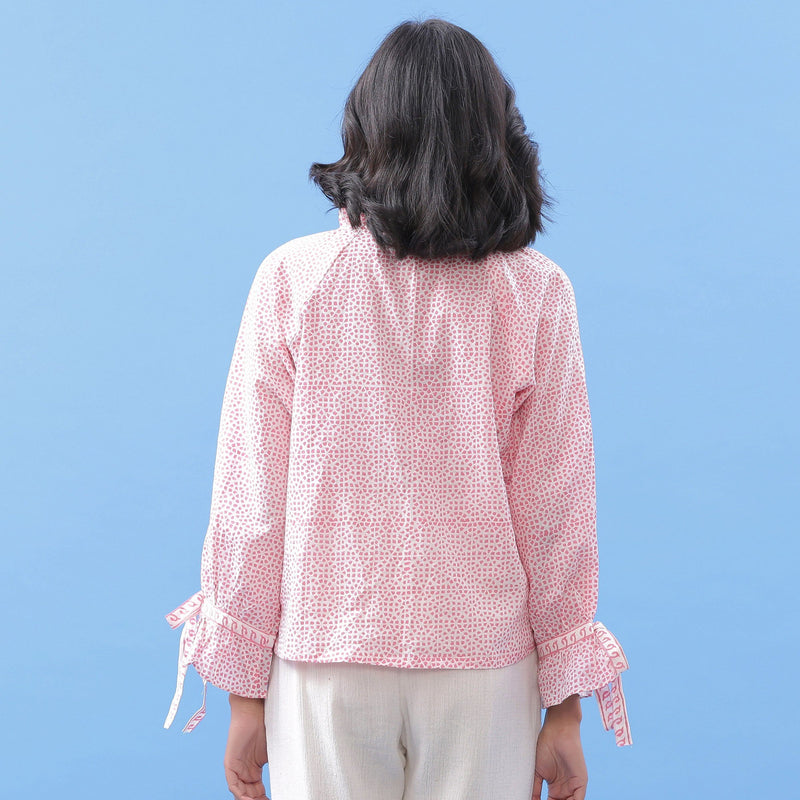 Back View of a Model wearing Pink Hand Block Printed Button-Down Blouse