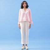 Front View of a Model wearing Pink Button-Down Blouse and Tapered Pant Set