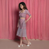 Left View of a Model wearing Pink Chanderi Hand Block Print Peplum Skirt