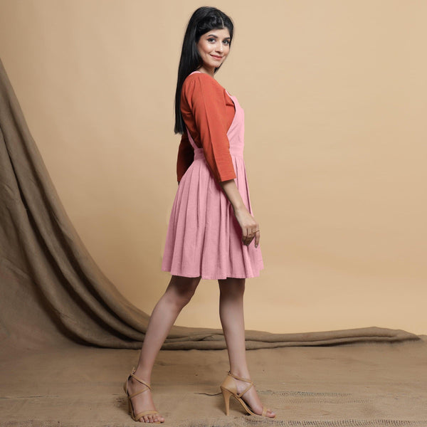 Right View of a Model wearing Pink Cotton Flax Pleated Knee Length Dress
