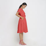 Right View of a Model wearing Pink Deep Neck Bohemian Frilled Dress