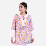 Front View of a Model wearing Pink Floral Block Print Frilled Sleeve Cotton Top
