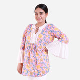 Front View of a Model wearing Pink Floral Block Print Frilled Sleeve Cotton Top