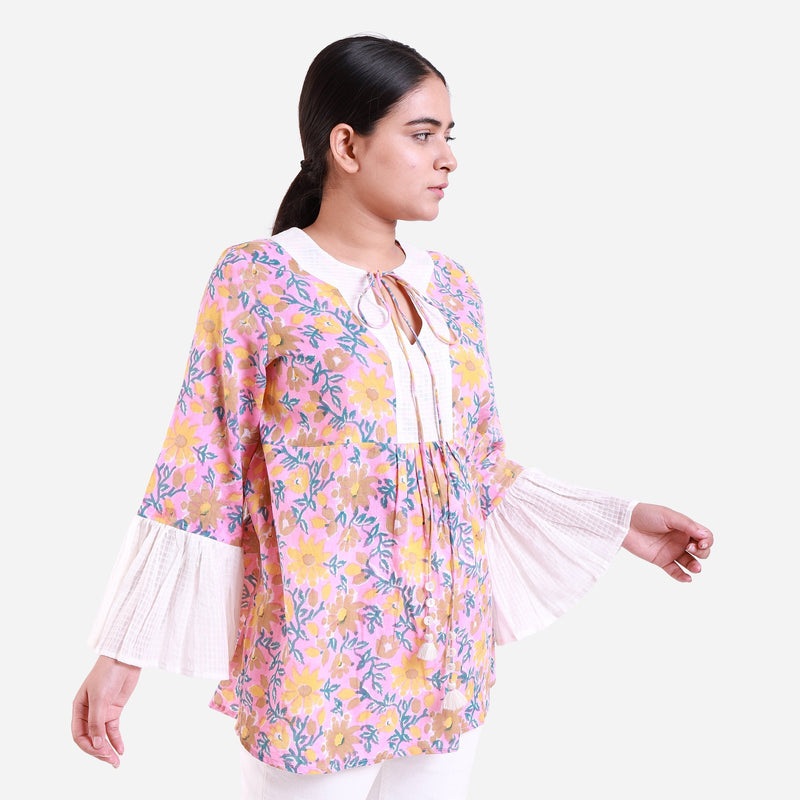 Right View of a Model wearing Pink Floral Block Print Frilled Sleeve Cotton Top