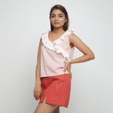 Left View of a Model wearing Pink Frilled Cotton Chambray Straight Top