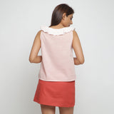 Back View of a Model wearing Pink Frilled Cotton Chambray Straight Top
