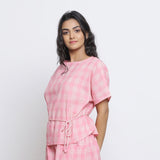 Left View of a Model wearing Pink Checks Handspun Cotton Muslin Loose Fit Boat Neck Top
