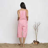 Back View of a Model wearing Pink Checks Handspun Cotton Strap Sleeve Midi Jumpsuit
