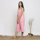 Left View of a Model wearing Pink Checks Handspun Cotton Strap Sleeve Midi Jumpsuit