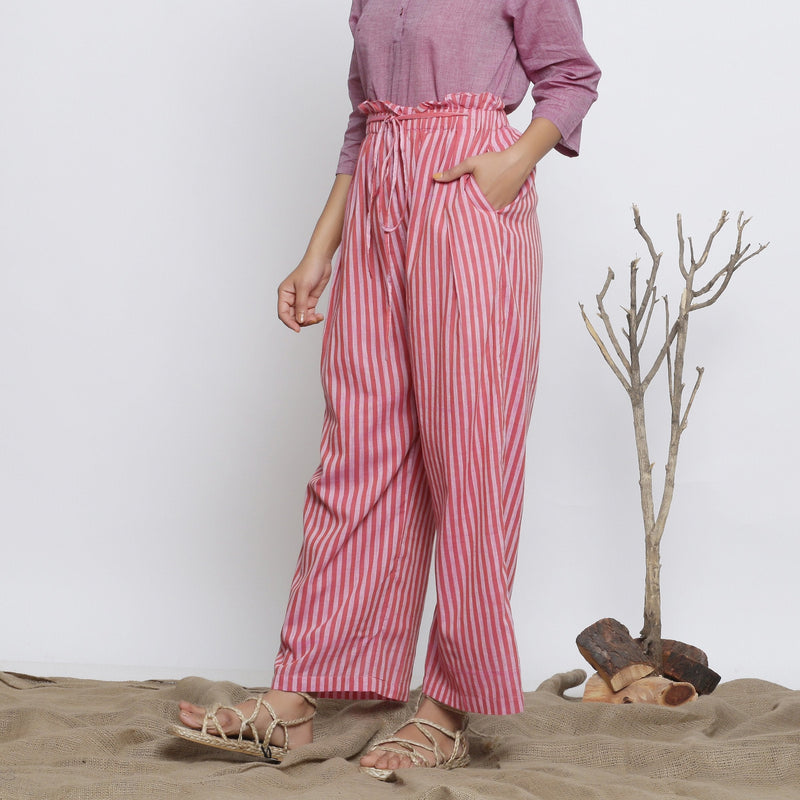 Left View of a Model wearing Pink Handspun Striped Paperbag Pant