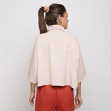 Back View of a Model wearing Pink Handspun Vegetable Dyed Crop Top
