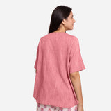 Back View of a Model wearing Pink Yarn Dyed Cotton High-Low Top