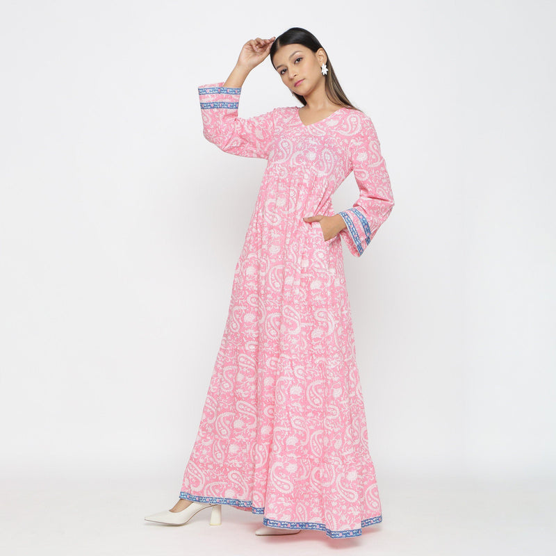 Left View of a Model wearing Pink Paisley Floor-Length Tier Dress