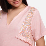 Front Detail of a Model wearing Powder Pink Cotton Chambray Short Top