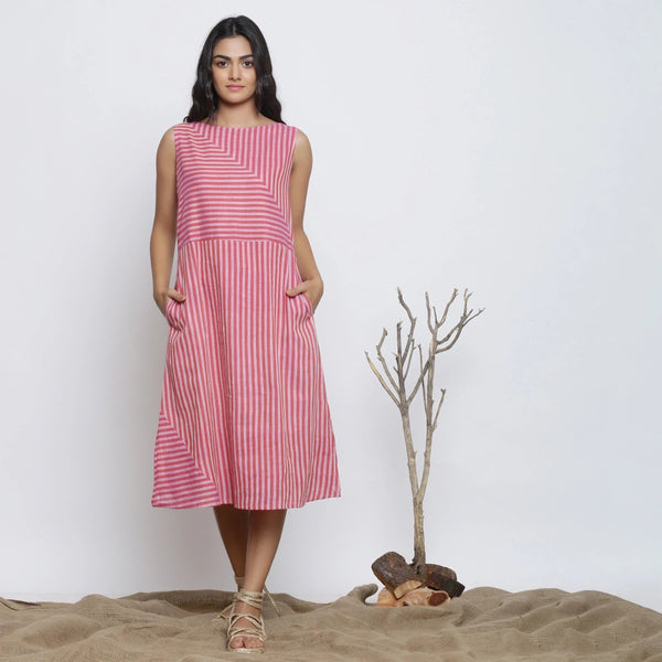 Front View of a Model wearing Pink Striped Sleeveless Paneled Dress
