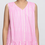 Front Detail of a Model wearing Pink Tie and Dye 100% Cotton Tiered V-Neck Short Dress