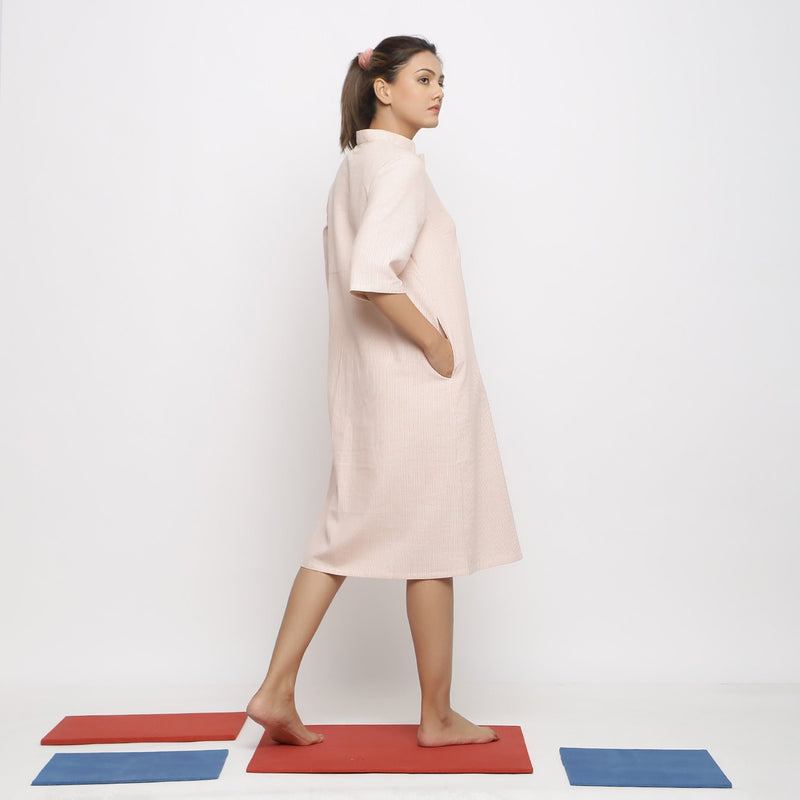 Right View of a Model wearing Pink Vegetable Dyed Button-Down Dress