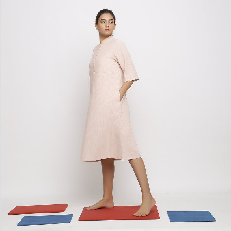 Left View of a Model wearing Pink Vegetable Dyed Button-Down Dress