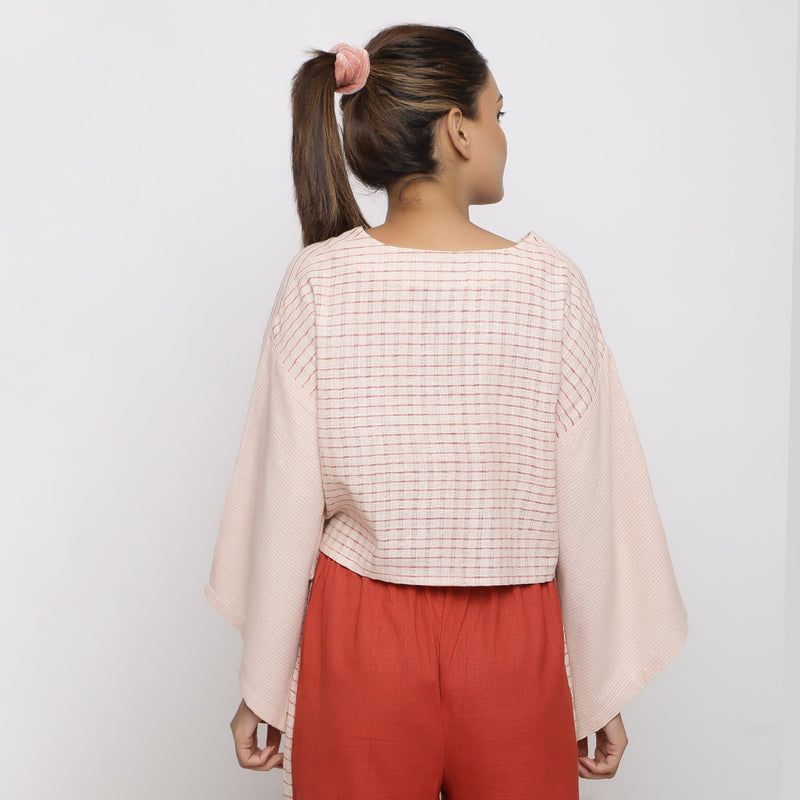 Back View of a Model wearing Beige and Pink Vegetable Dyed Handspun Cotton V-Neck Crop Top