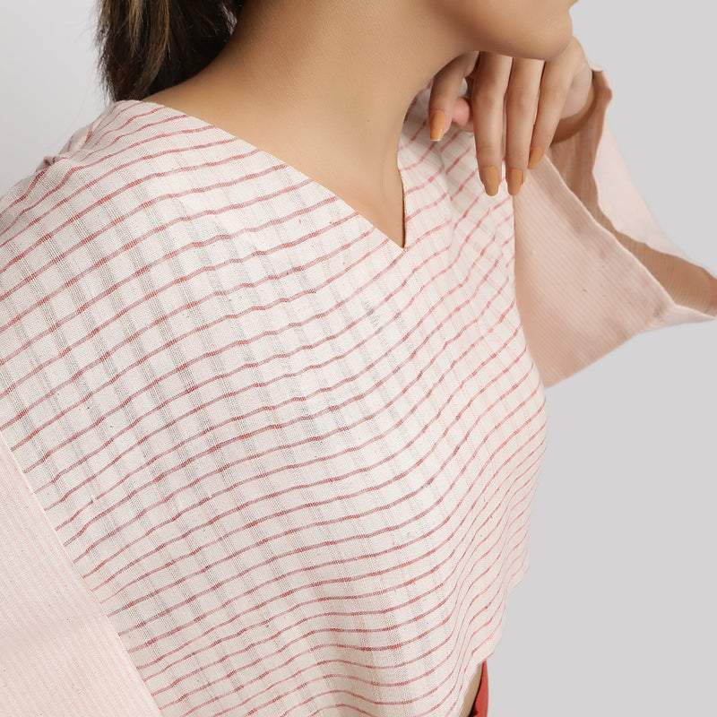 Front Detail of a Model wearing Beige and Pink Vegetable Dyed Handspun Cotton V-Neck Crop Top