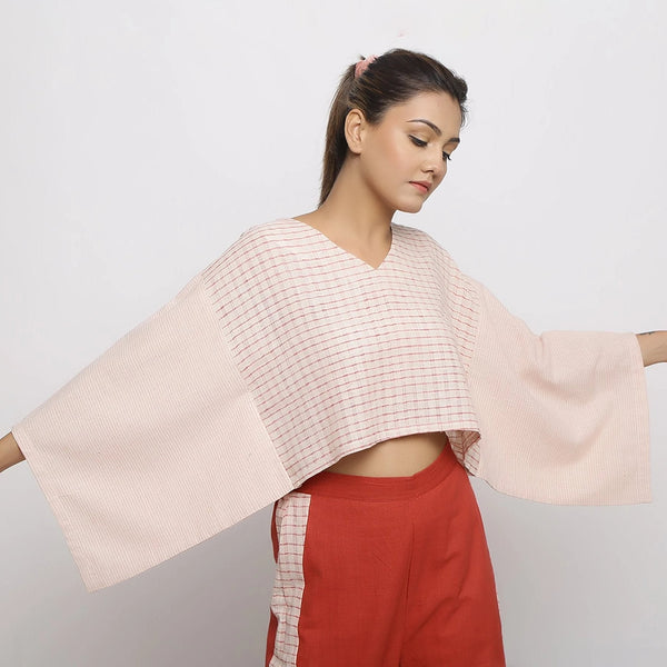 Right View of a Model wearing Beige and Pink Vegetable Dyed Handspun Cotton V-Neck Crop Top