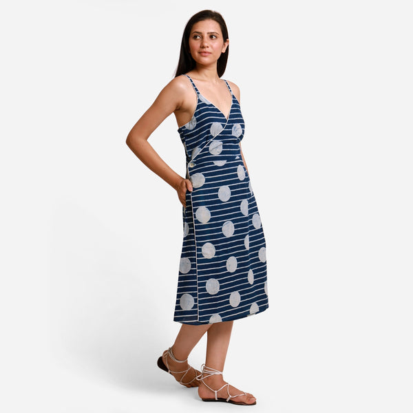 Right View of a Model wearing Polka Dot Block Printed Asymmetrical Cotton Midi Dress