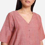 Front Detail of a Model wearing Poppy Peach A-Line Button-Down Top