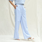 Right View of a Model wearing Powder Blue Checks Cotton High-Rise Wide Legged Pant