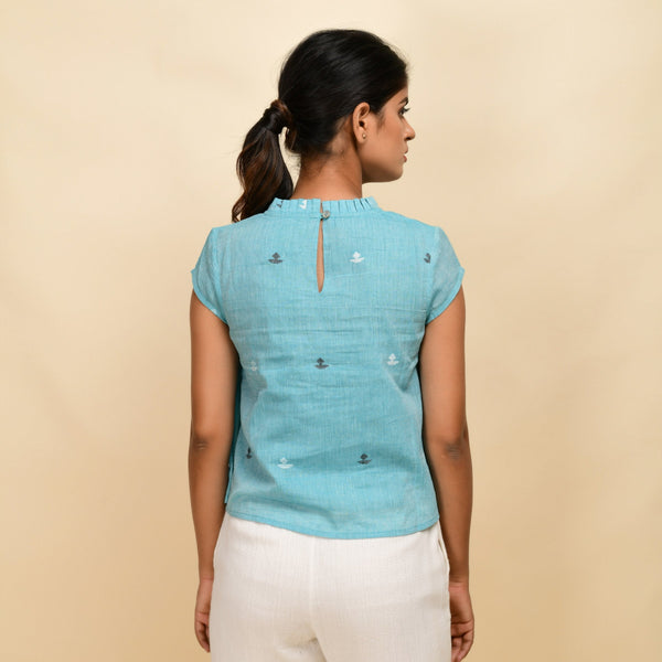 Back View of a Model wearing Powder Blue Cotton Muslin Ruffled Collar Jamdani Top