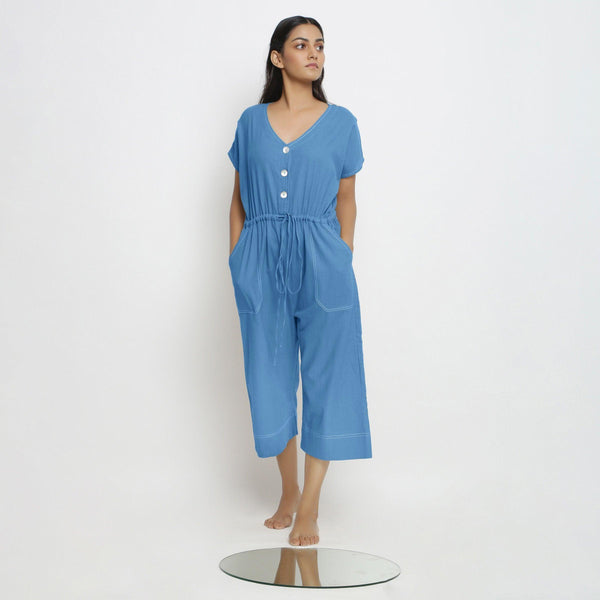 Front View of a Model wearing Powder Blue Vegetable Dyed Button-Down Jumpsuit