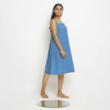 Right View of a Model wearing Powder Blue Vegetable Dyed Handspun Slip Dress