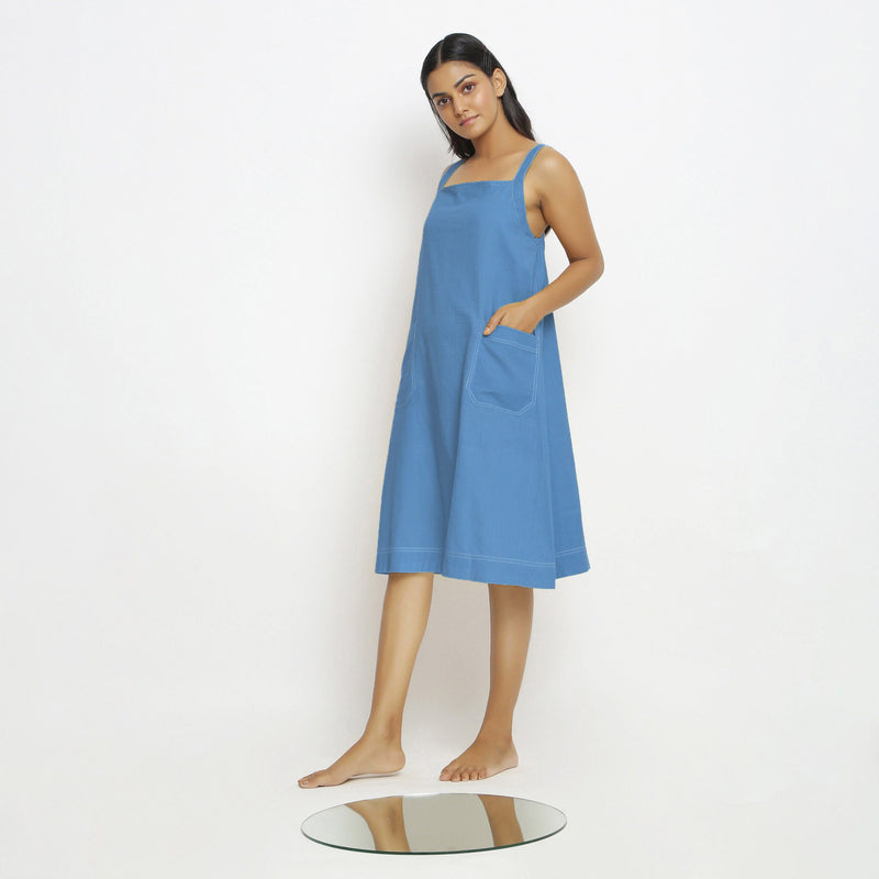 Left View of a Model wearing Powder Blue Vegetable Dyed Handspun Slip Dress