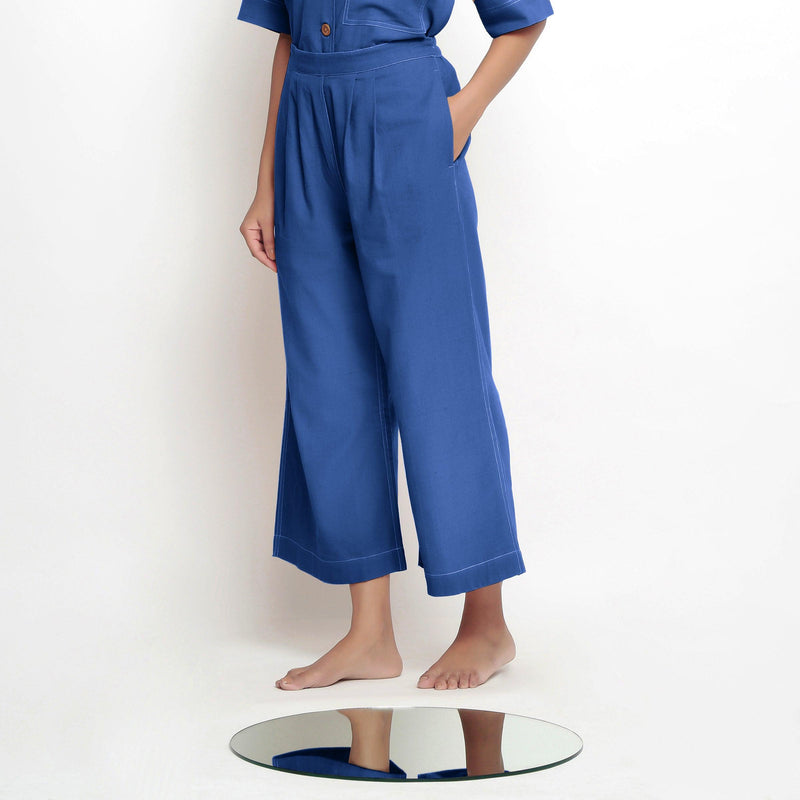Left View of a Model wearing Powder Blue Vegetable Dyed Wide Legged Pant