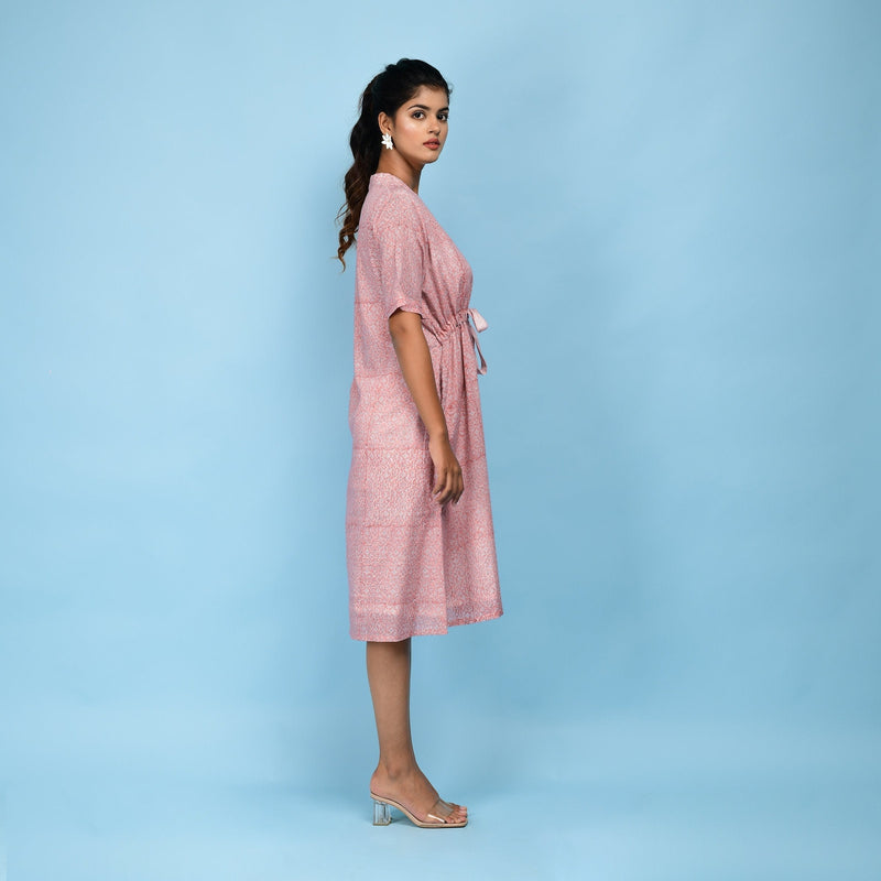 Right View of a Model wearing Powder Pink Cotton Block Print Knee-Length Kaftan Dress