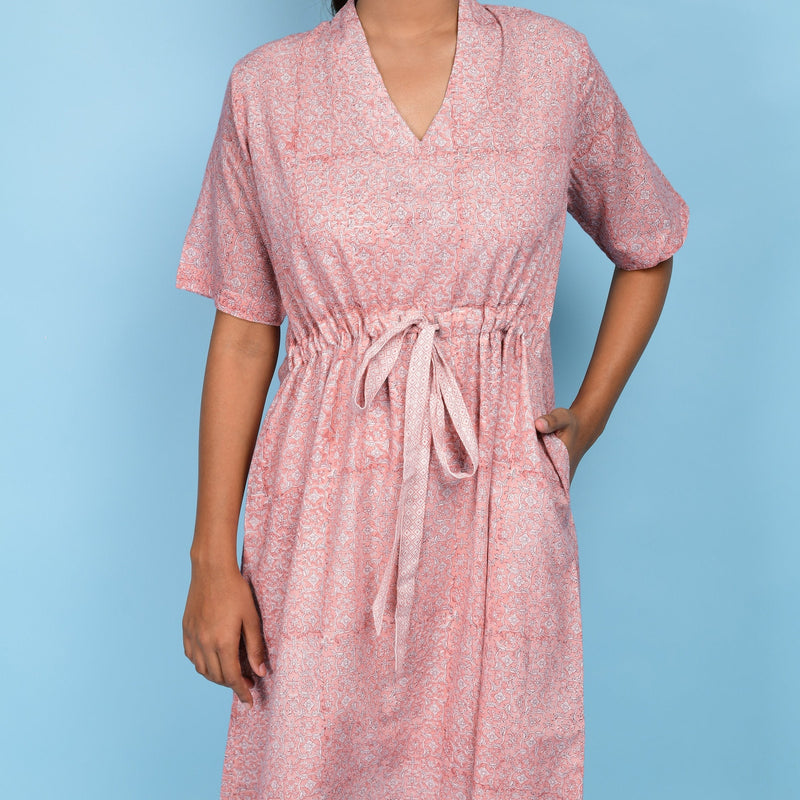 Front Detail of a Model wearing Powder Pink Cotton Block Print Knee-Length Kaftan Dress
