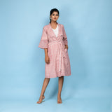 Front View of a Model wearing Powder Pink Block Printed 100% Cotton Knee-Length Overlay