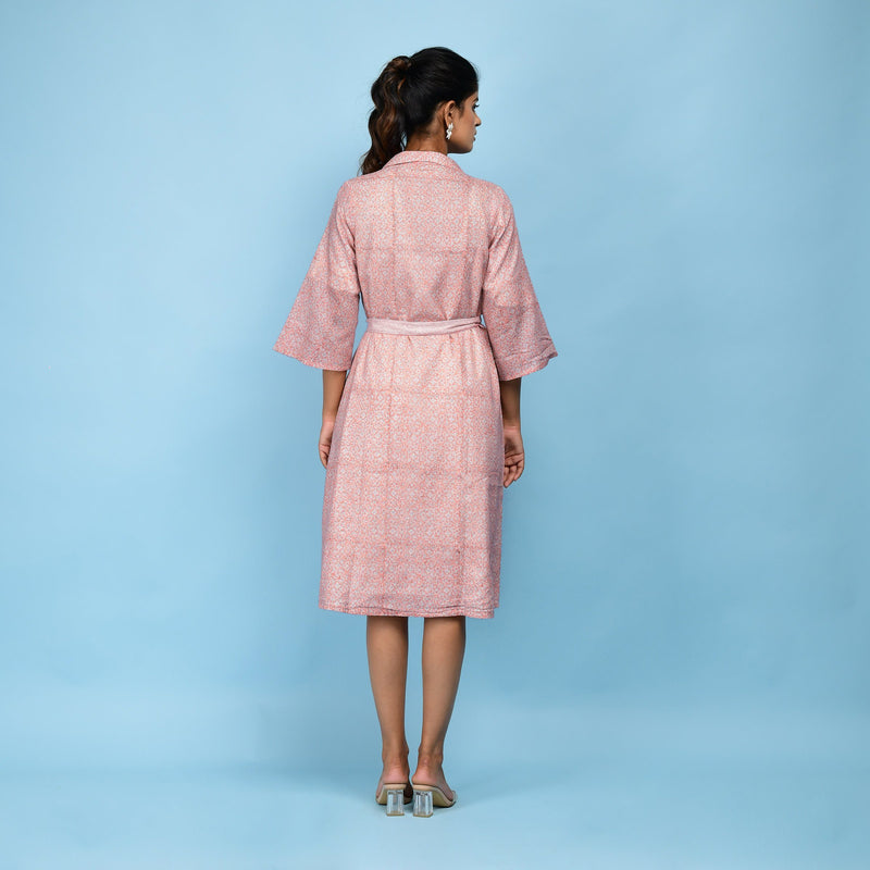 Back View of a Model wearing Powder Pink Block Printed 100% Cotton Knee-Length Overlay
