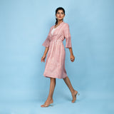 Left View of a Model wearing Powder Pink Block Printed 100% Cotton Knee-Length Overlay