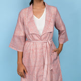Front Detail of a Model wearing Powder Pink Block Printed 100% Cotton Knee-Length Overlay