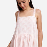 Front Detail of a Model wearing Powder Pink Cotton Block Print Gathered Maxi Dress