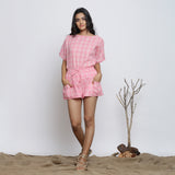 Front View of a Model wearing 'Powder Pink Handspun Cotton Mid-Rise Elasticated Shorts