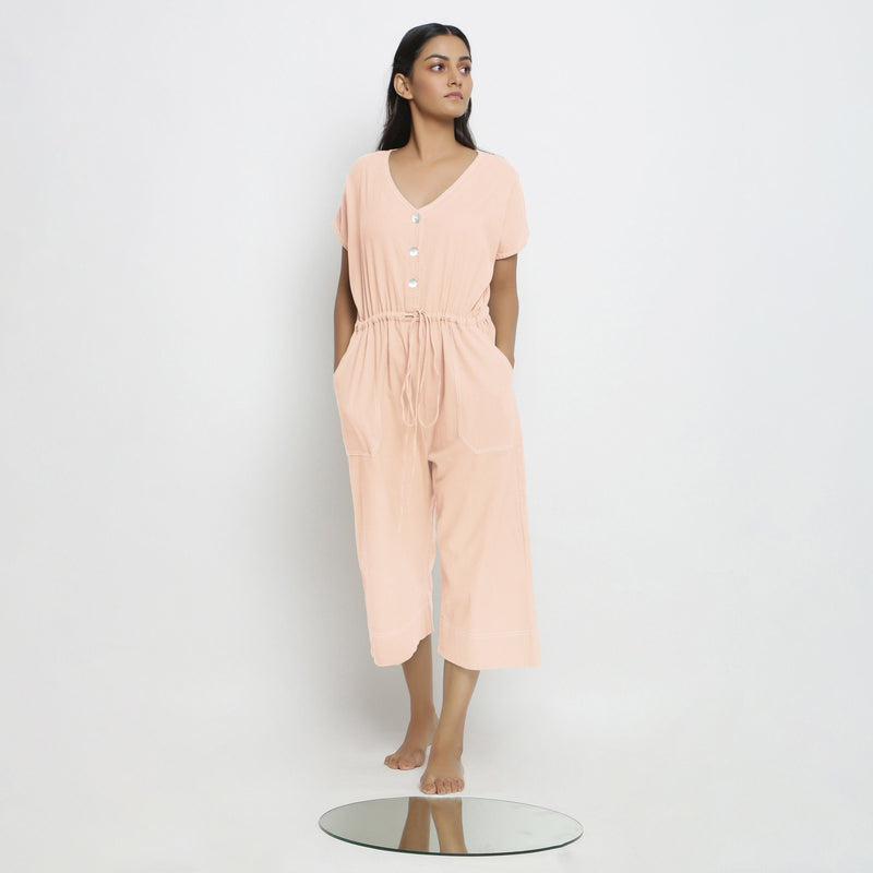 Front View of a Model wearing Powder Pink Vegetable Dyed Button-Down Jumpsuit
