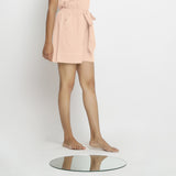 Right View of a Model wearing Powder Pink Vegetable Dyed Handspun Short Shorts