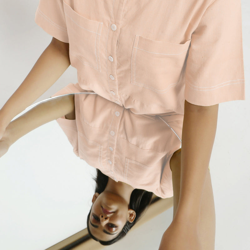 Front Detail of a Model wearing Powder Pink Vegetable Dyed Romper