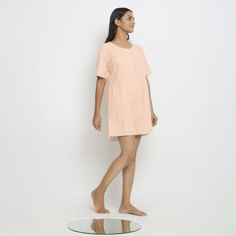 Right View of a Model wearing Powder Pink Vegetable Dyed Romper