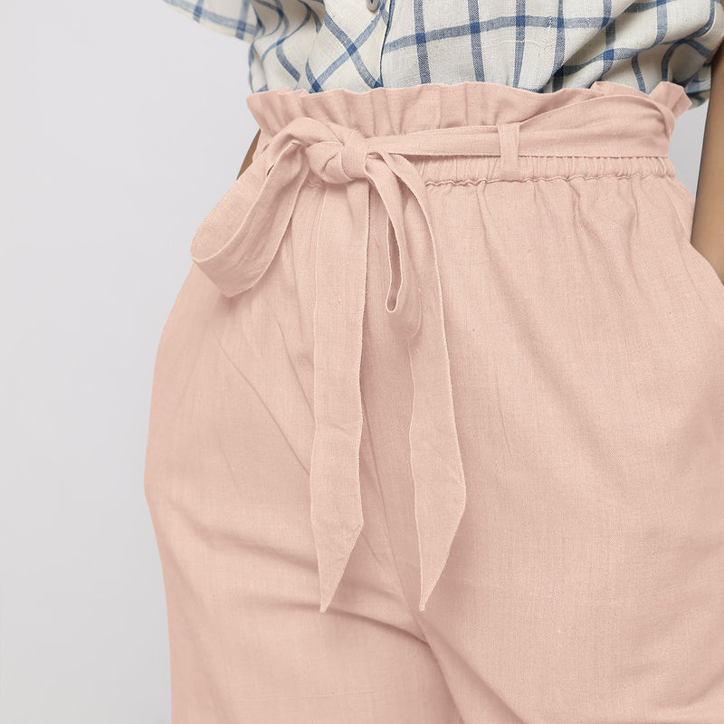 Front Detail of a Model wearing Powder Pink Vegetable Dyed Wide Legged Paperbag Pant