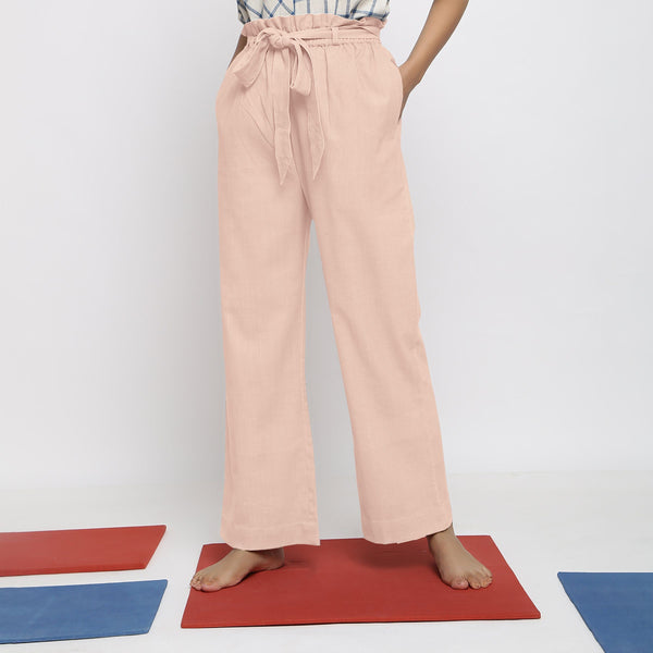 Front View of a Model wearing Powder Pink Vegetable Dyed Wide Legged Paperbag Pant